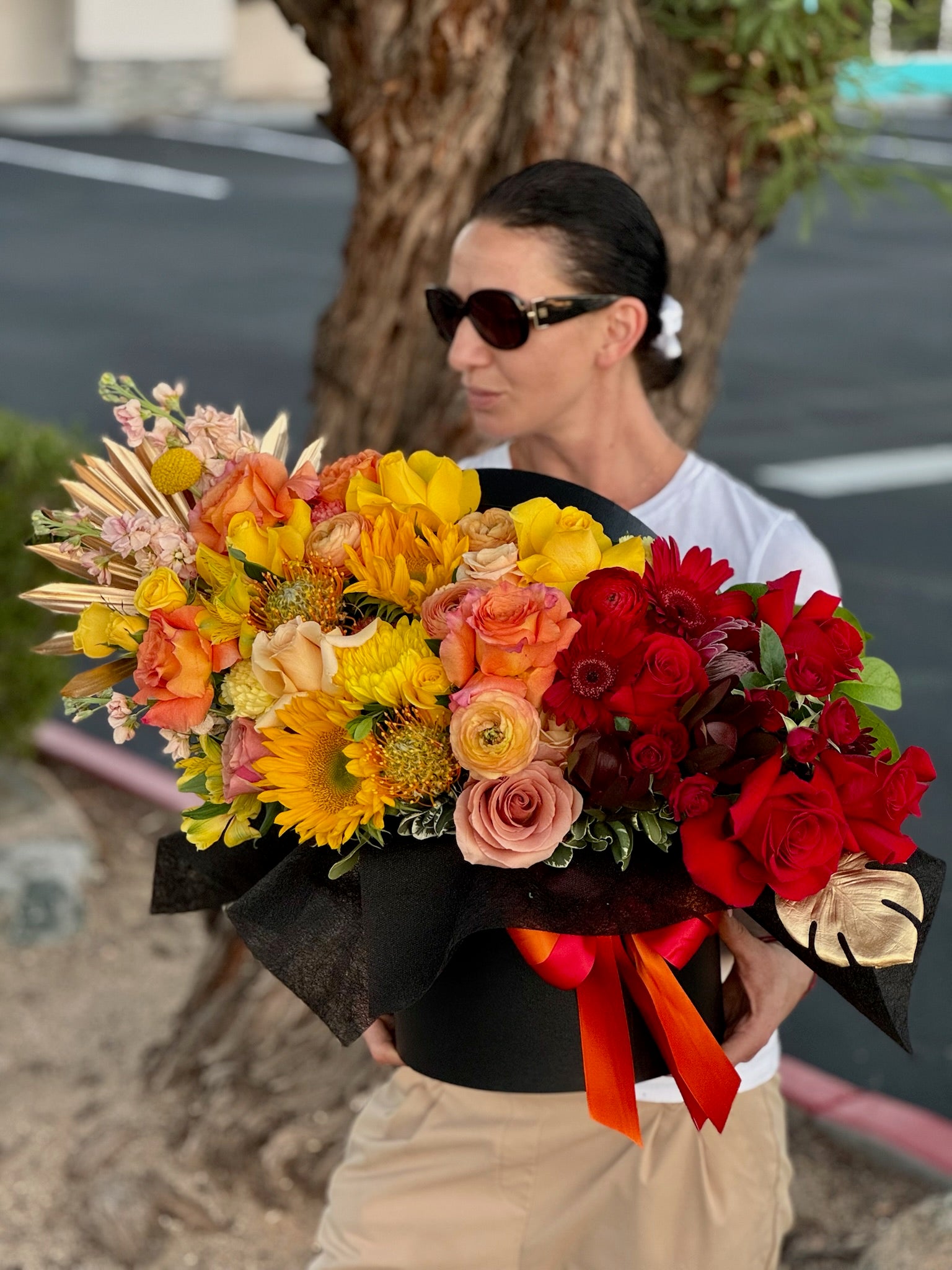 Phoenixia luxury red and gold hatbox flower arrangement by Imagine Flowers—florist in Scottsdale with same-day delivery.